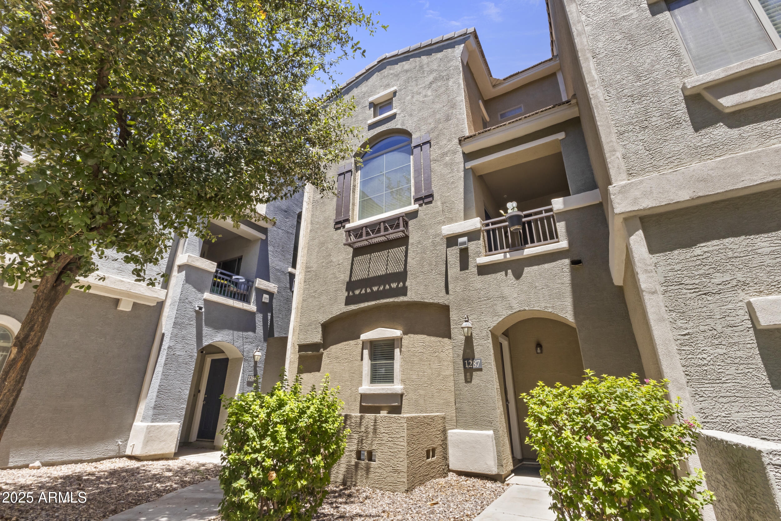 280 South Evergreen Road, Unit 1287 Tempe, AZ 85288 - Photo 1 of 28 a front view of a multi story residential apartment building