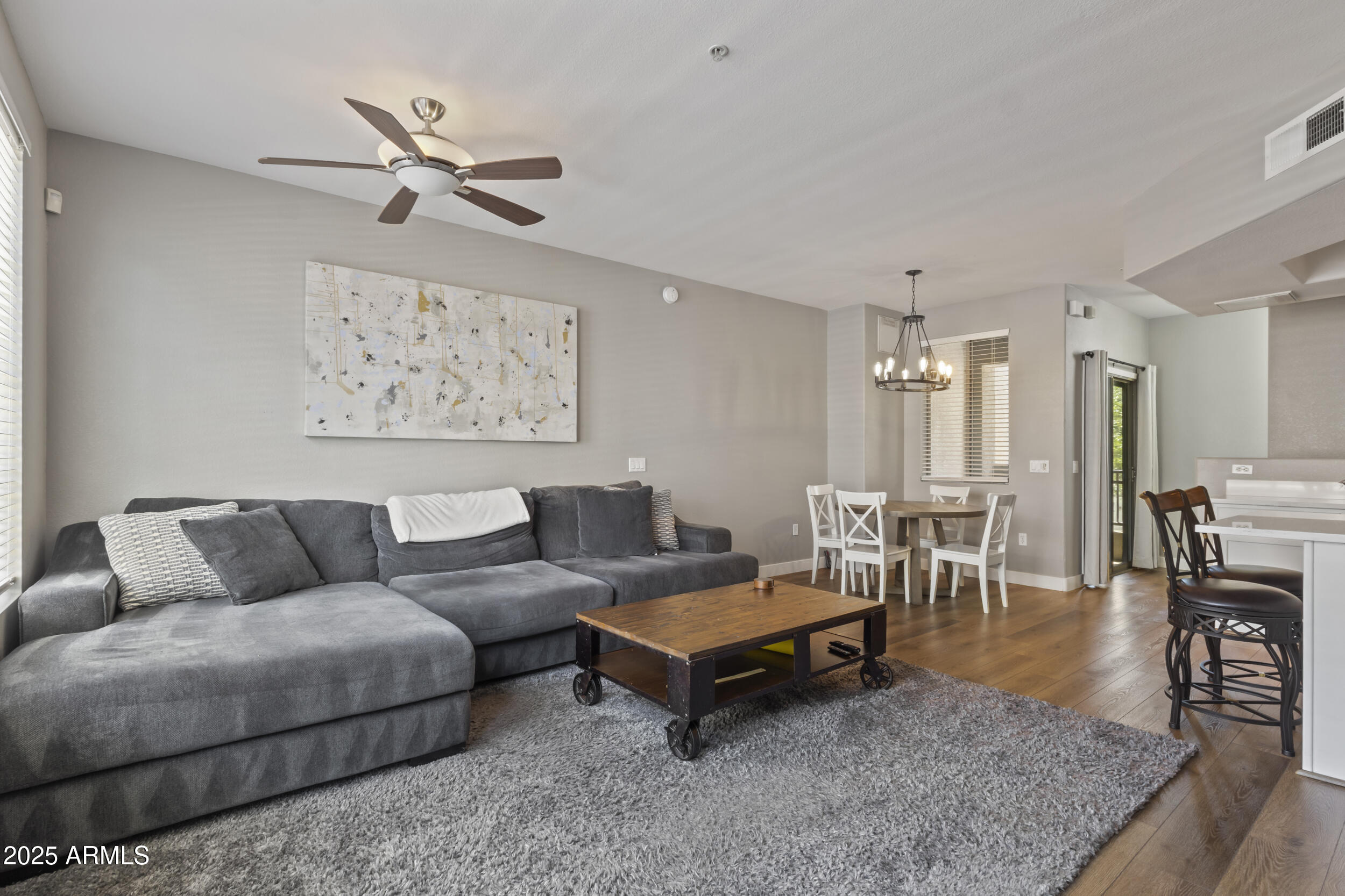 280 South Evergreen Road, Unit 1287 Tempe, AZ 85288 - Photo 8 of 28 a living room with furniture and a view of kitchen