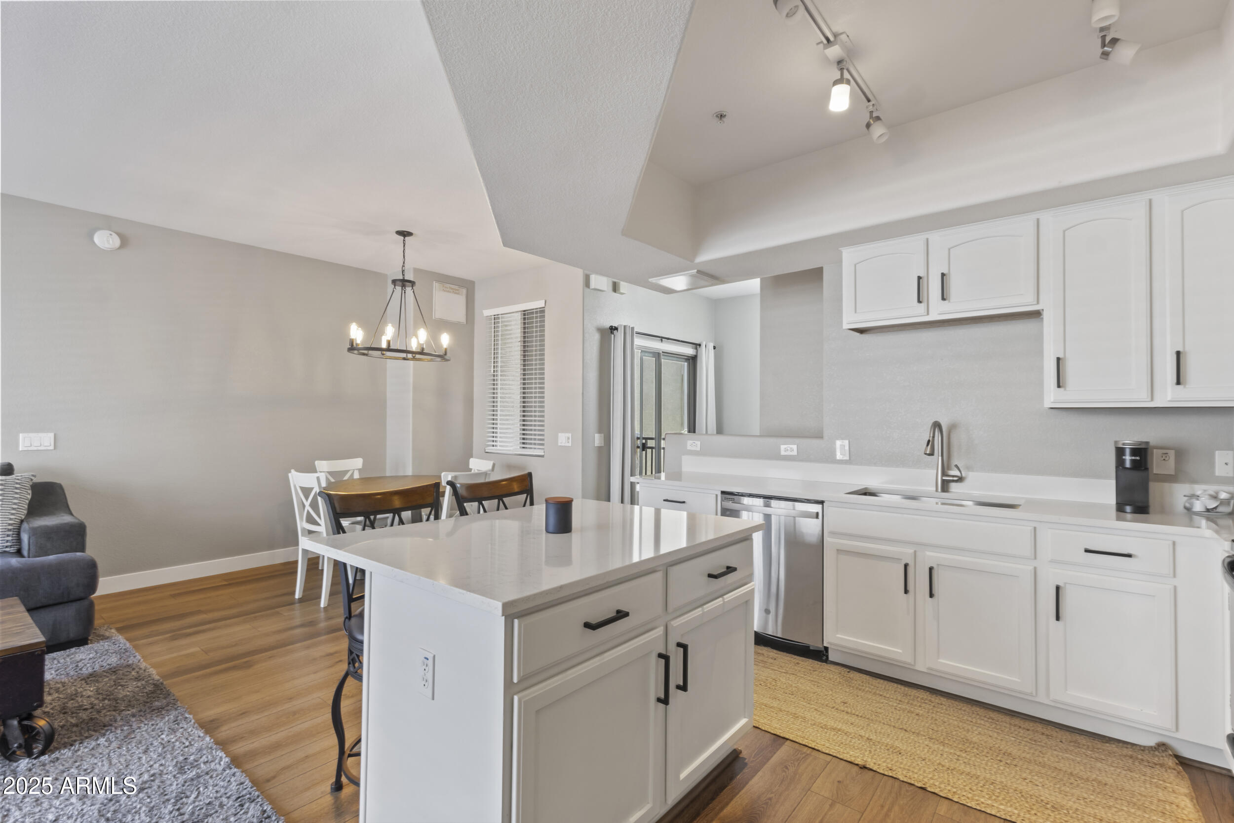 280 South Evergreen Road, Unit 1287 Tempe, AZ 85288 - Photo 10 of 28 a kitchen with a sink stove and cabinets