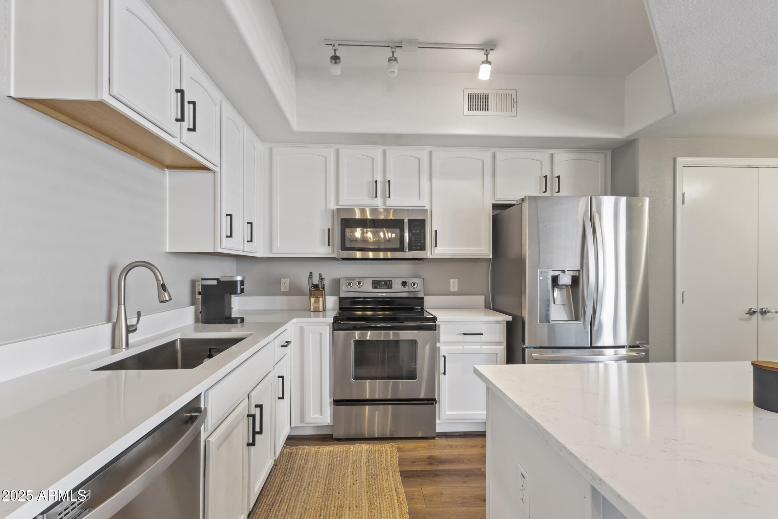 280 South Evergreen Road, Unit 1287 Tempe, AZ 85288 - Photo 11 of 28 a kitchen with a sink stove and refrigerator