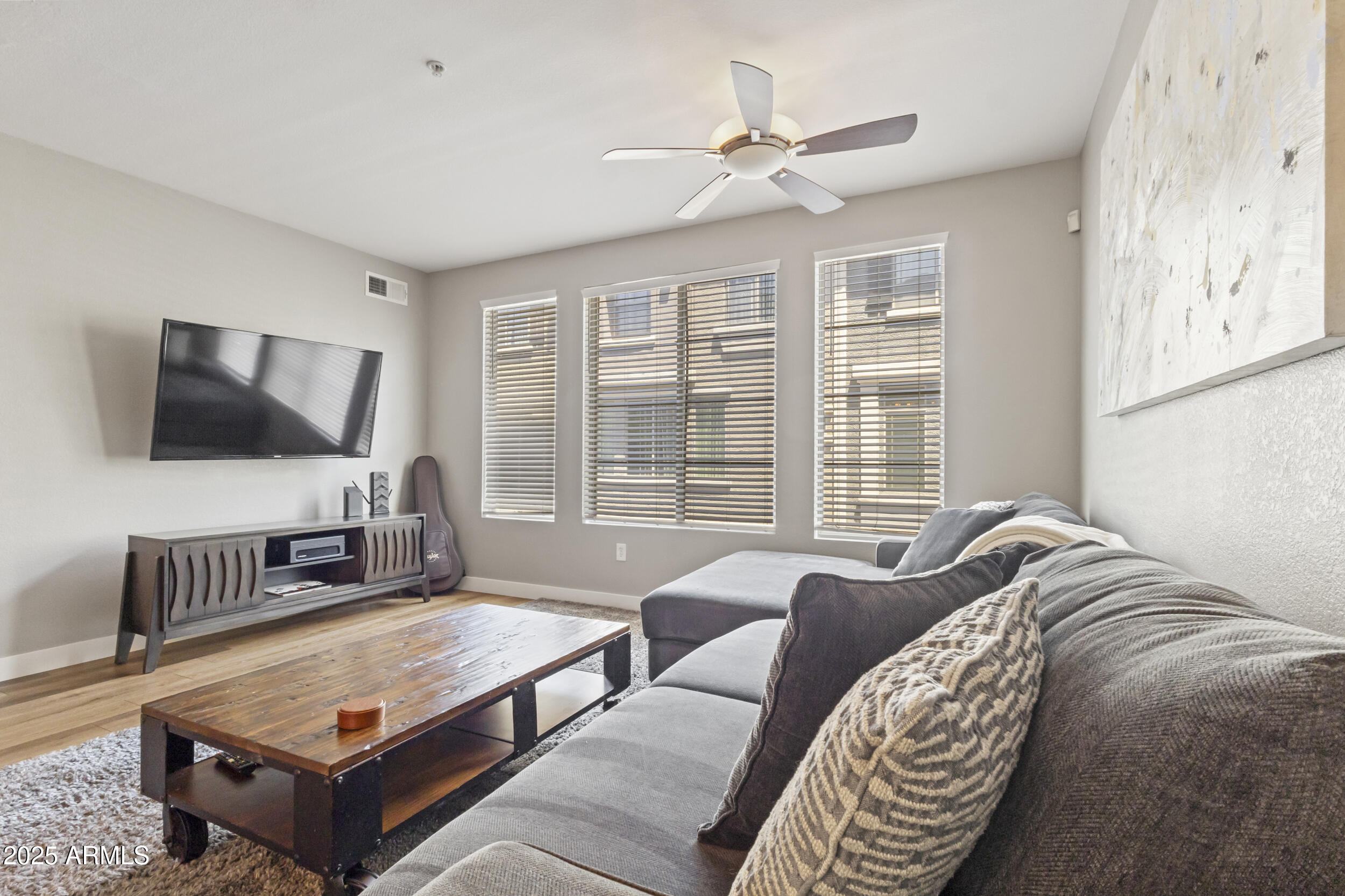280 South Evergreen Road, Unit 1287 Tempe, AZ 85288 - Photo 12 of 28 a living room with furniture and a flat screen tv
