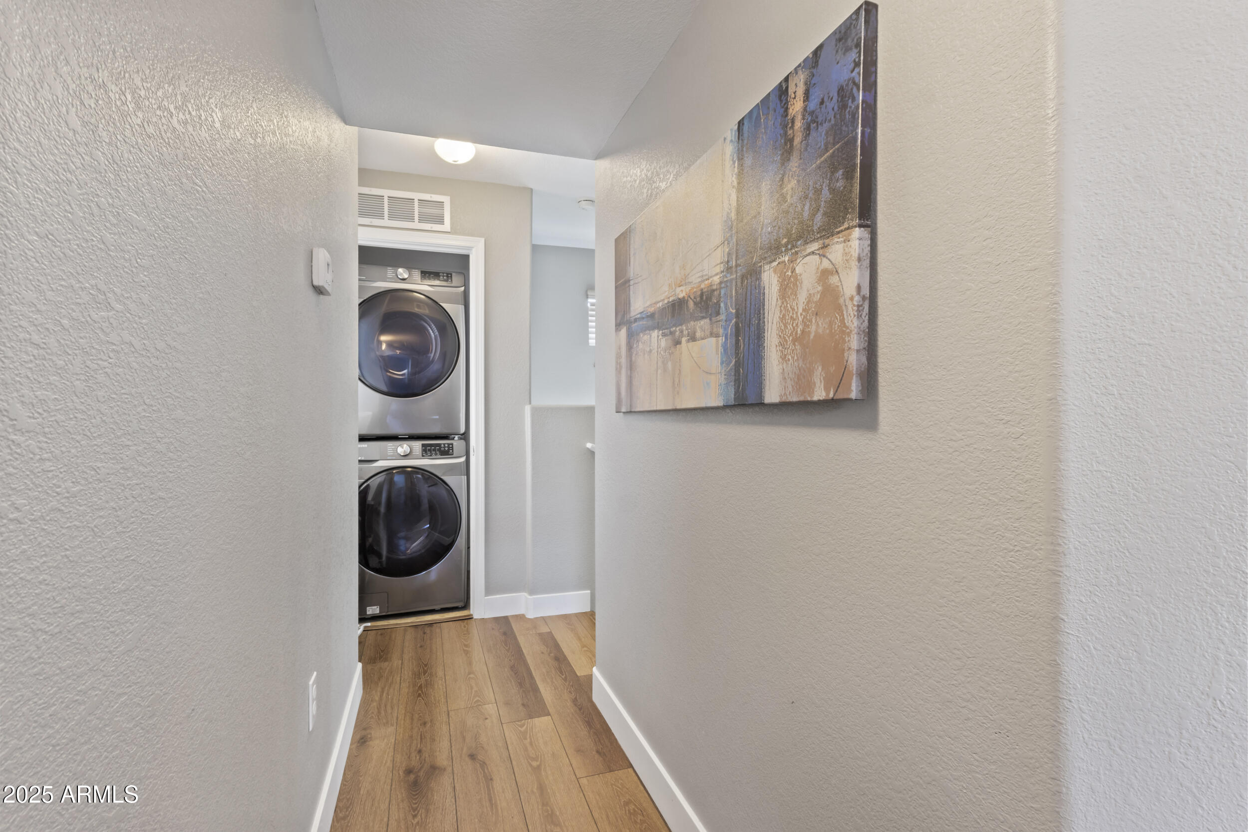 280 South Evergreen Road, Unit 1287 Tempe, AZ 85288 - Photo 15 of 28 a view of a hallway with washer and dryer