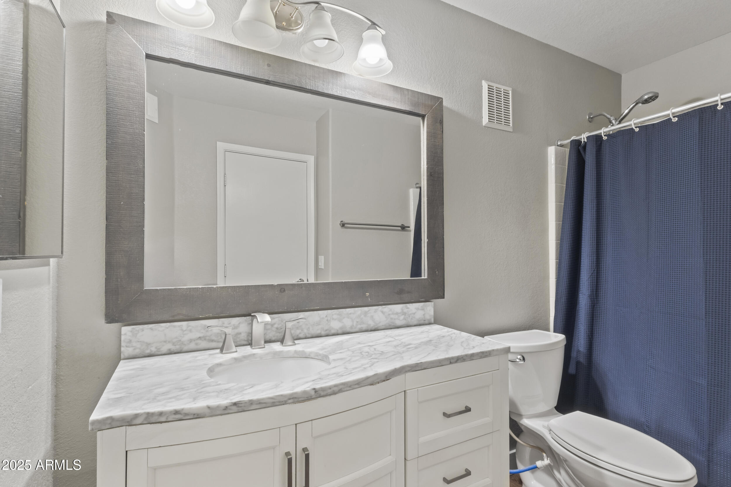 280 South Evergreen Road, Unit 1287 Tempe, AZ 85288 - Photo 18 of 28 a bathroom with a granite countertop sink toilet and shower