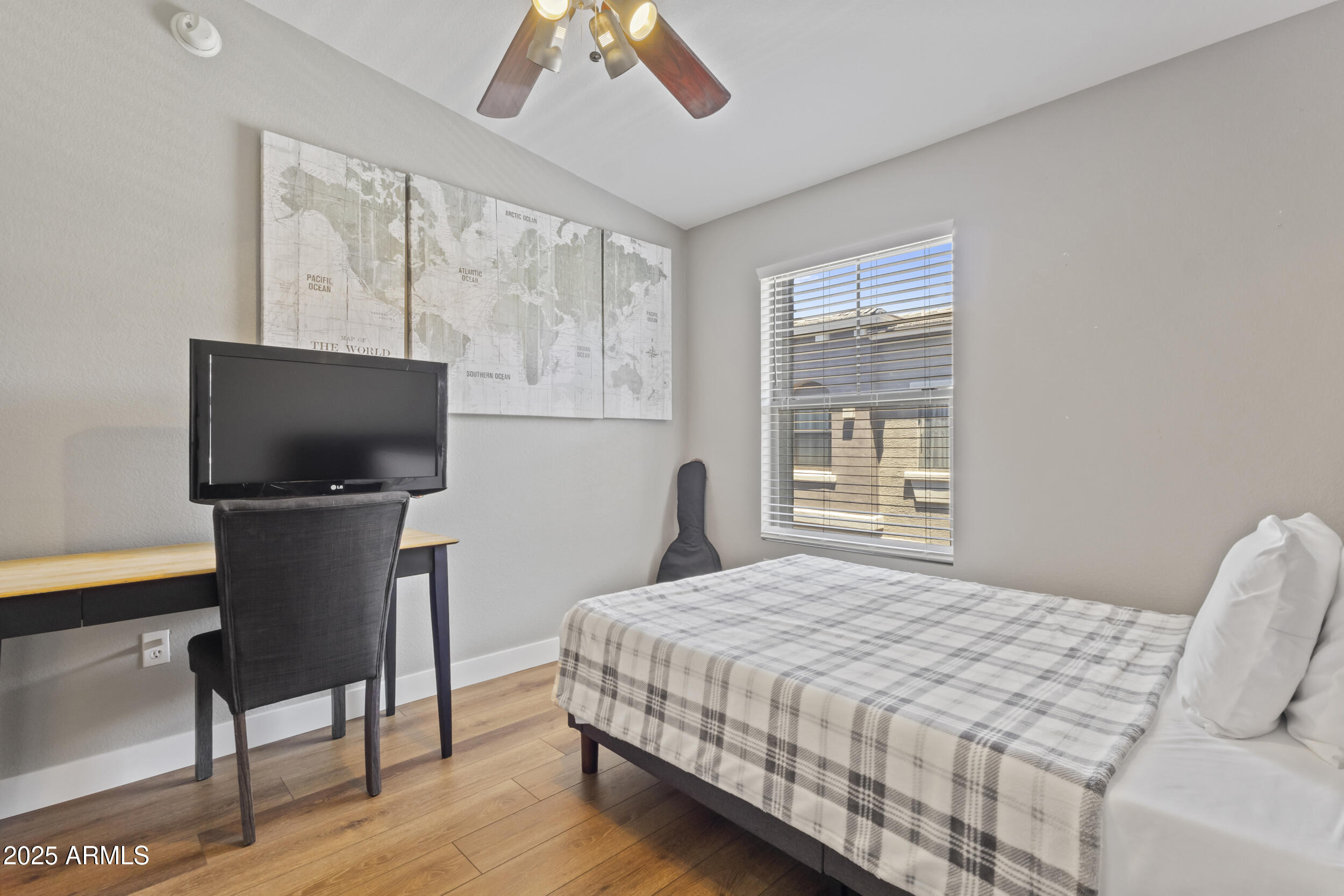 280 South Evergreen Road, Unit 1287 Tempe, AZ 85288 - Photo 19 of 28 a bedroom with a bed television on desk and a window