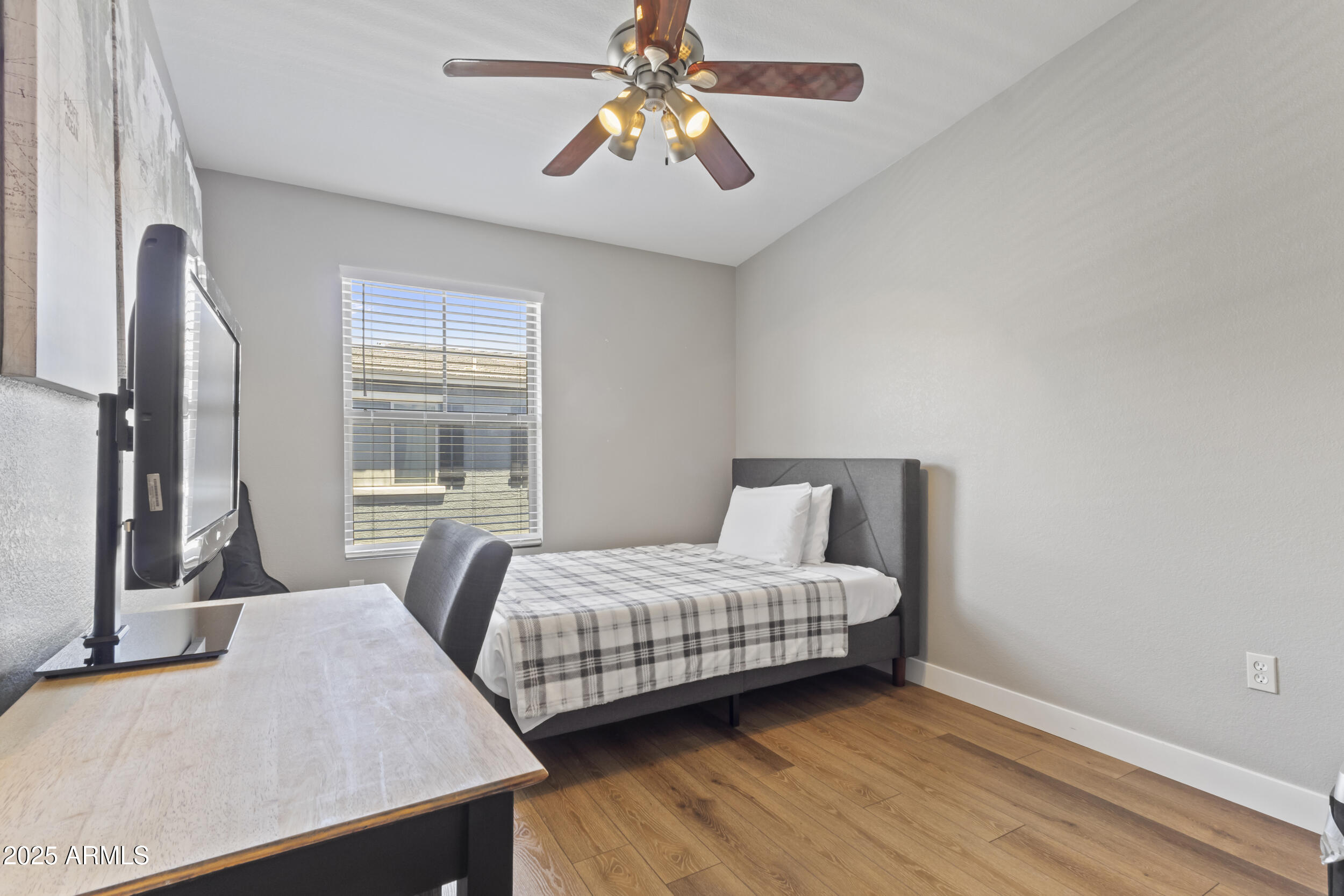280 South Evergreen Road, Unit 1287 Tempe, AZ 85288 - Photo 20 of 28 a bedroom with a bed and a chandelier