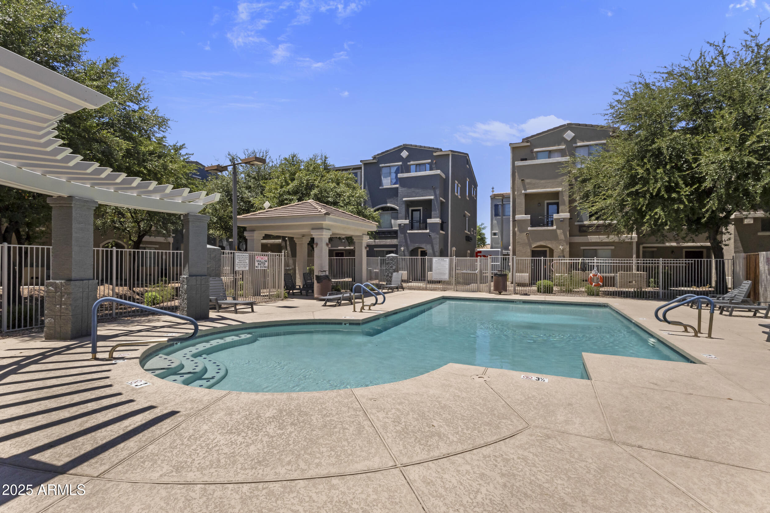 280 South Evergreen Road, Unit 1287 Tempe, AZ 85288 - Photo 22 of 28 a view of a house with swimming pool and sitting area