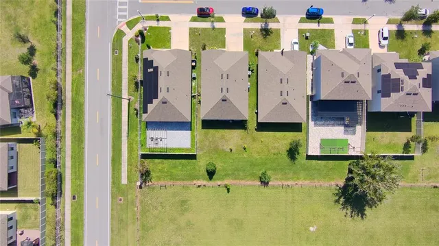 a swimming pool with outdoor seating and yard
