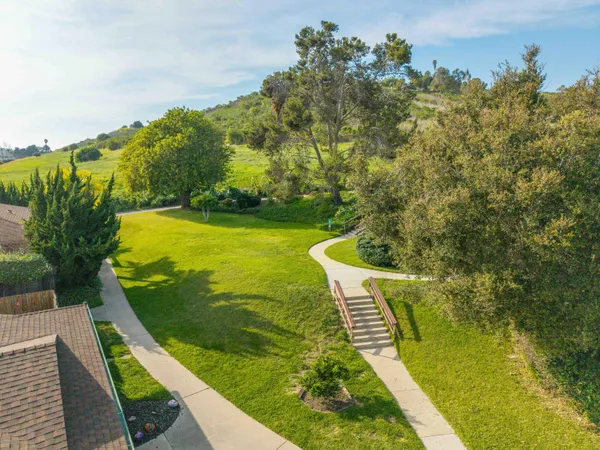 a view of a swimming pool with a yard