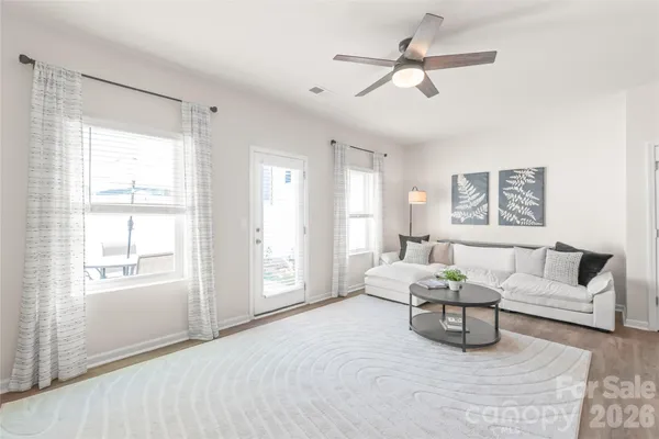 a living room with furniture and a window
