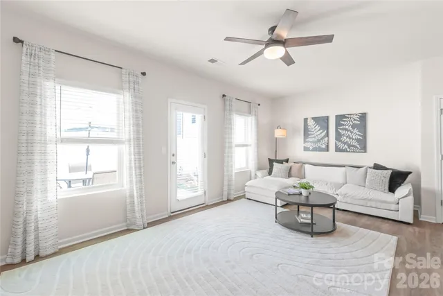 a living room with furniture and a window