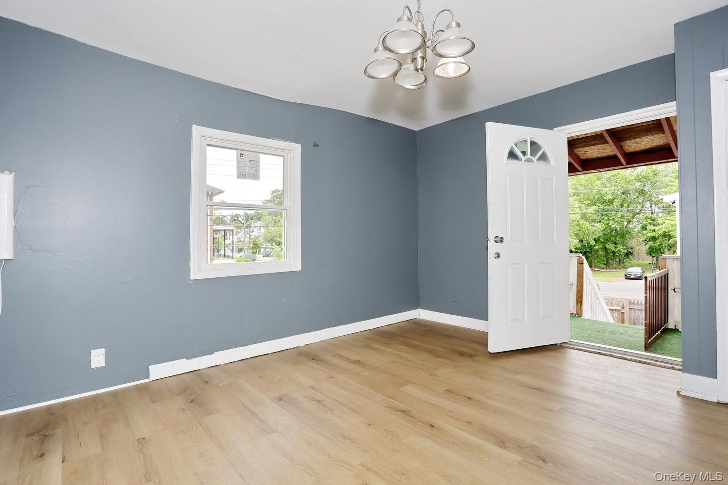 29 Fairview Avenue Spring Valley, NY 10977 - Photo 4 of 19 a view of empty room with wooden floor and fan