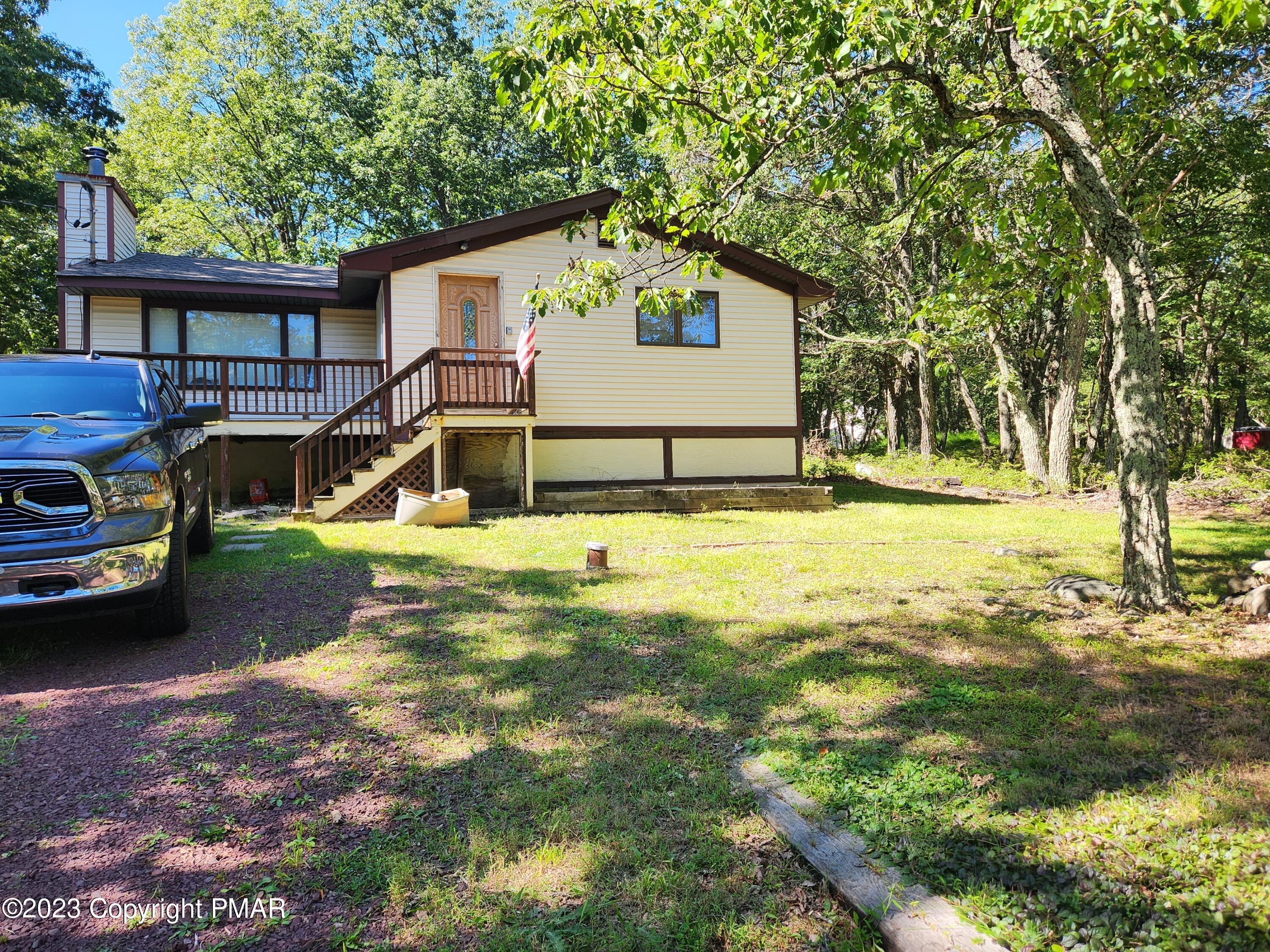 218 Mallard Lane Bushkill, PA 18324 - Photo 1 of 14 a view of a house with yard and sitting area