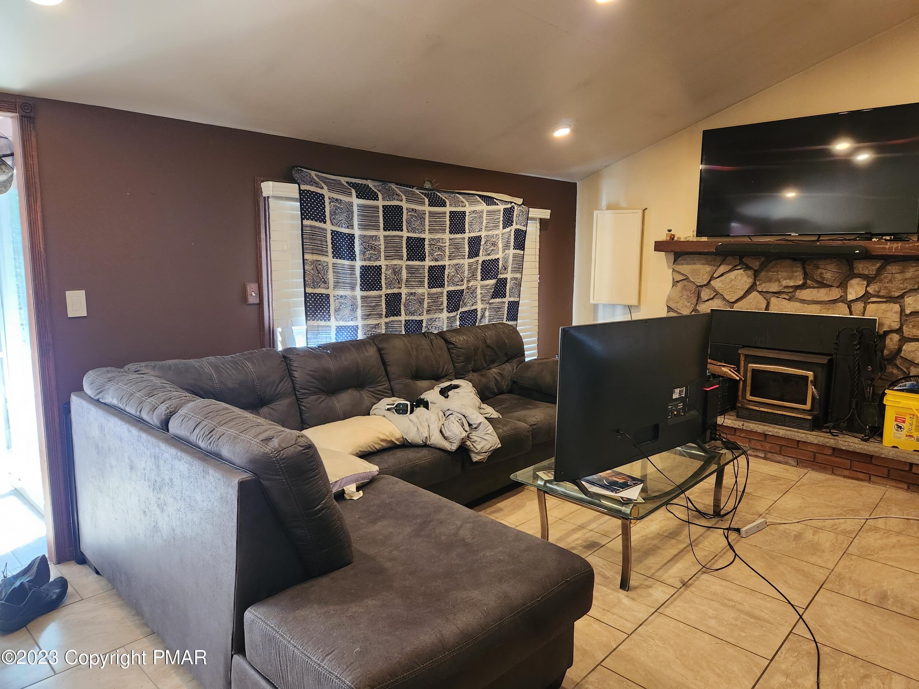 218 Mallard Lane Bushkill, PA 18324 - Photo 13 of 14 a living room with furniture and a flat screen tv