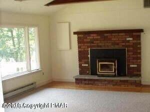 218 Mallard Lane Bushkill, PA 18324 - Photo 3 of 14 a view of an empty room with a fireplace