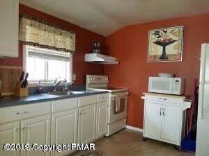 218 Mallard Lane Bushkill, PA 18324 - Photo 4 of 14 a kitchen with cabinets and window