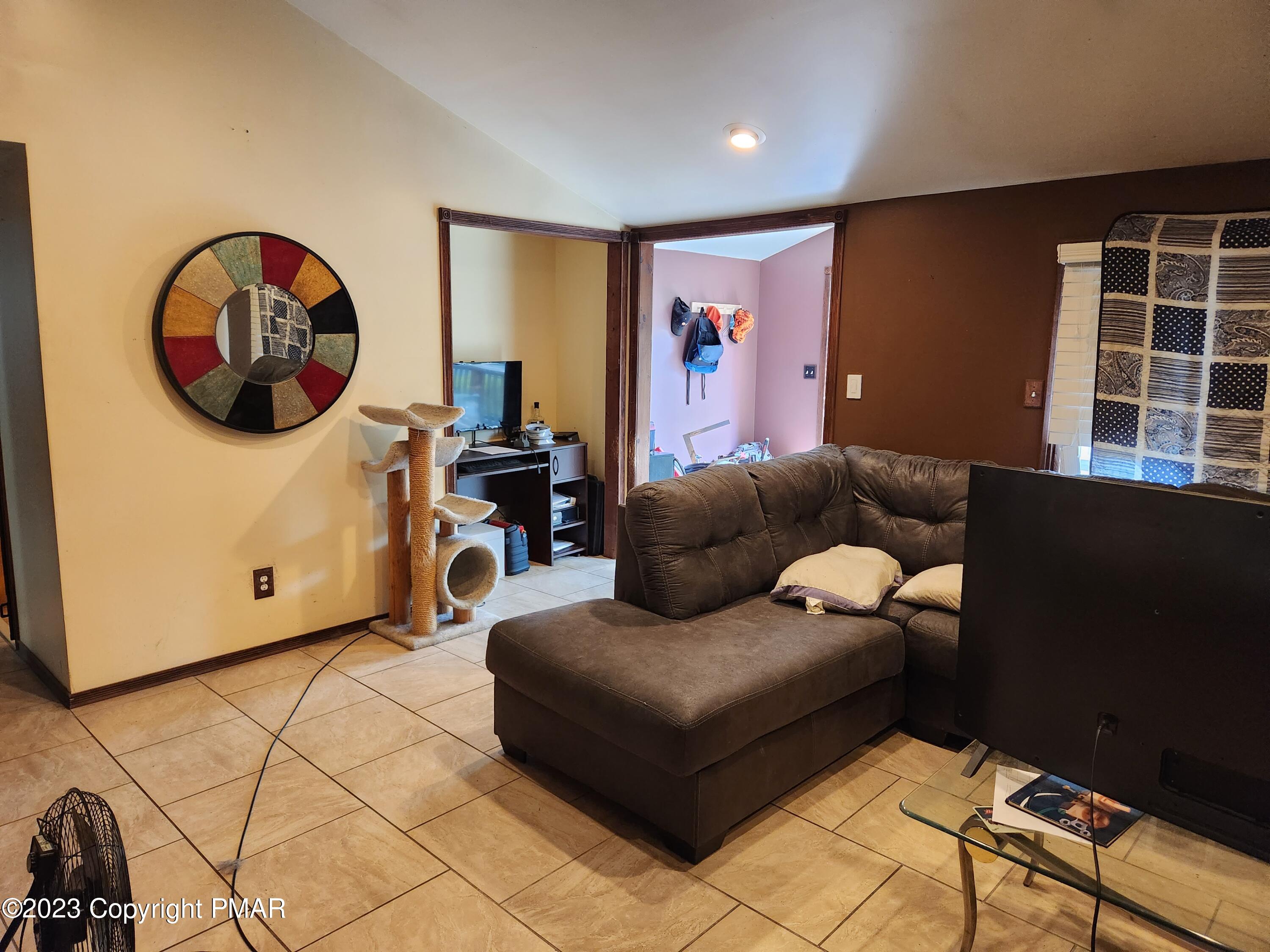 218 Mallard Lane Bushkill, PA 18324 - Photo 5 of 14 a living room with furniture and a window