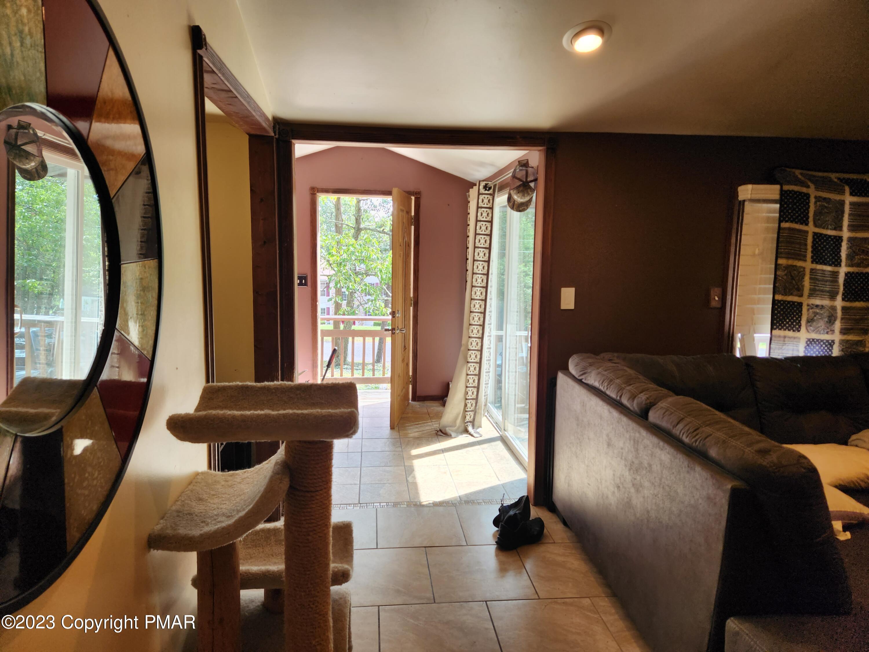 218 Mallard Lane Bushkill, PA 18324 - Photo 6 of 14 a living room with furniture and a large window