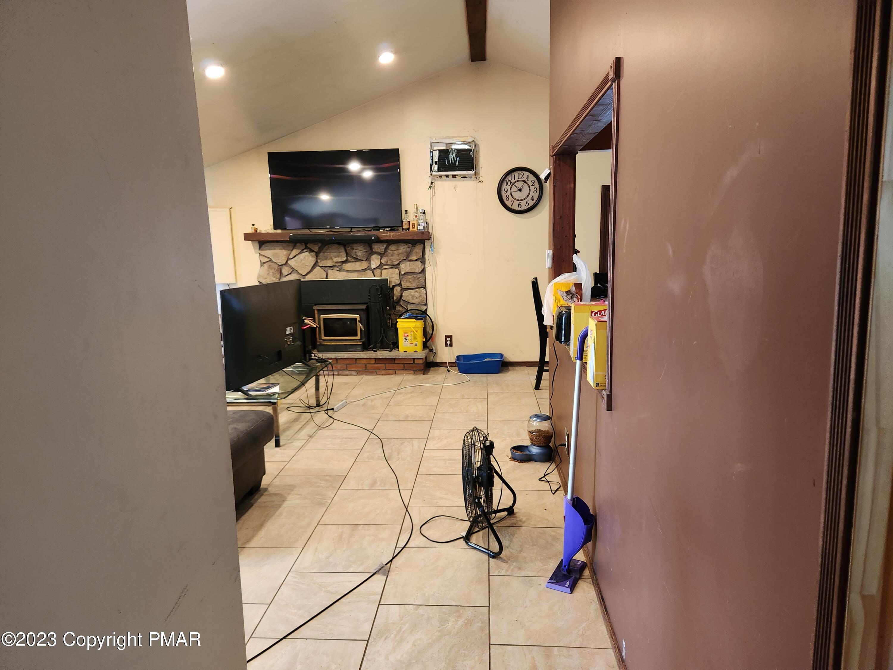 218 Mallard Lane Bushkill, PA 18324 - Photo 10 of 14 a view of living room with furniture and a flat screen tv