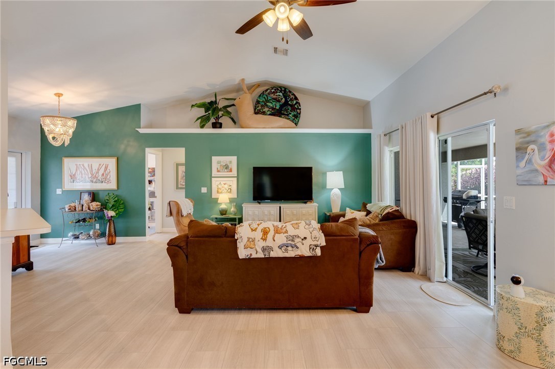3801 28th Street Southwest Lehigh Acres, FL 33976 - Photo 6 of 37 a living room with furniture and a fireplace