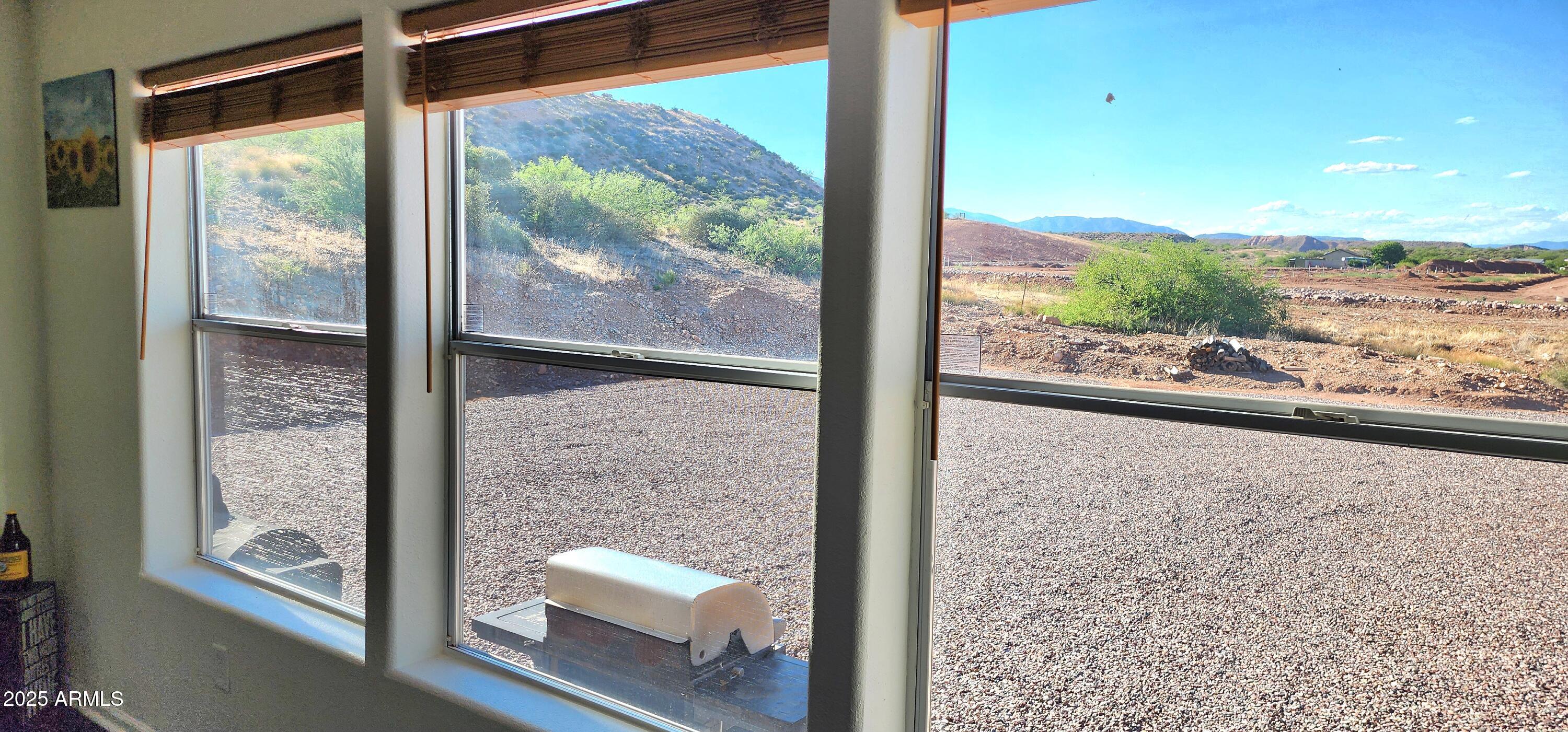 234 West Lone Ranger Trail Tonto Basin, AZ 85553 - Photo 15 of 27 a view of a room with wooden floor and windows