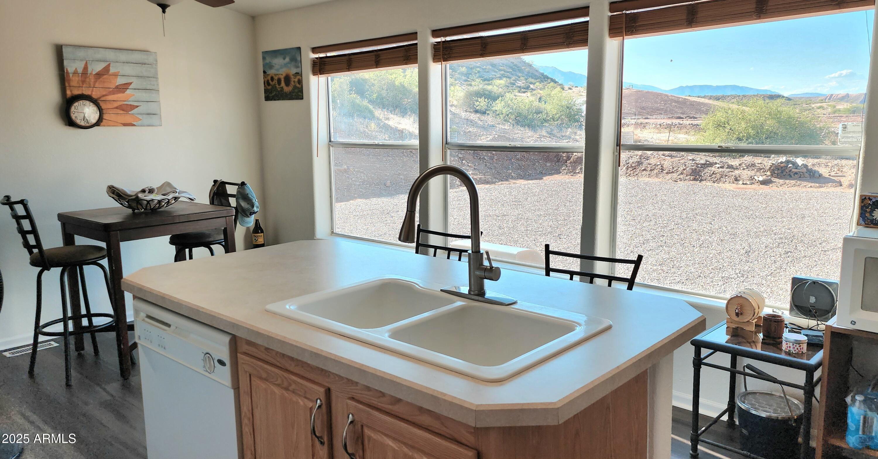234 West Lone Ranger Trail Tonto Basin, AZ 85553 - Photo 16 of 27 a view of a dining table and chairs in the balcony