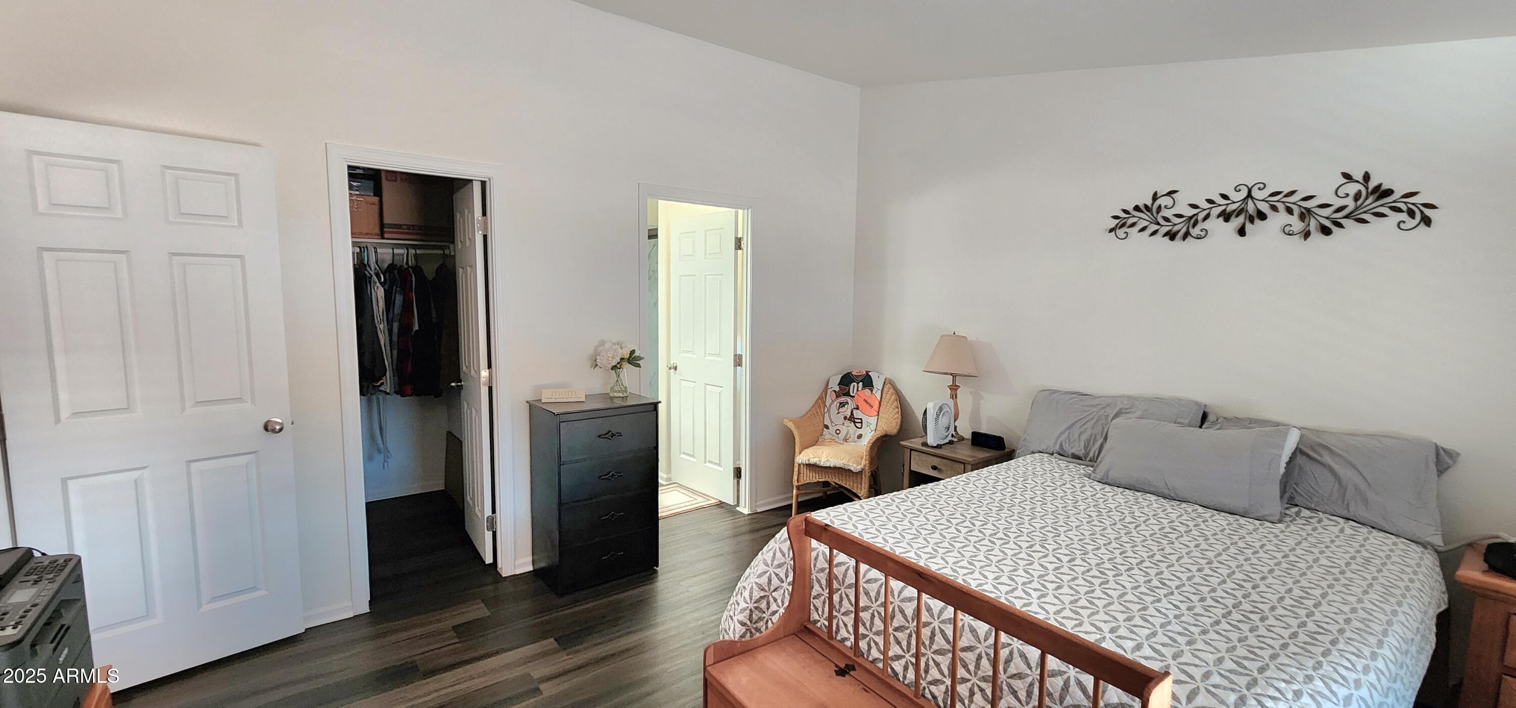 234 West Lone Ranger Trail Tonto Basin, AZ 85553 - Photo 18 of 27 a bedroom with a bed and wooden floor