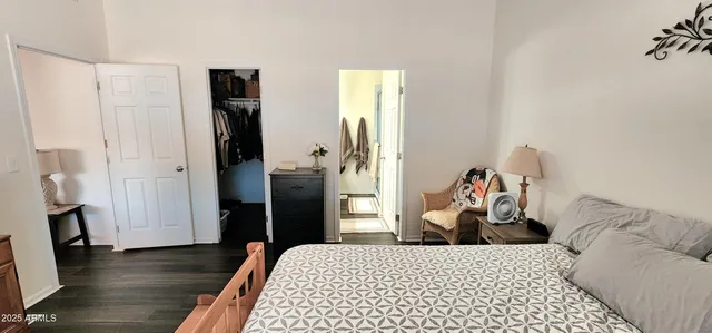 a bedroom with a bed and a dresser