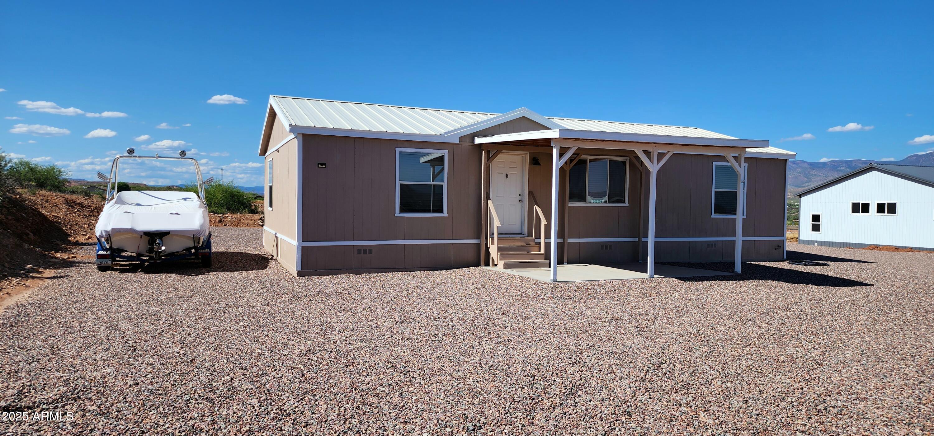 234 West Lone Ranger Trail Tonto Basin, AZ 85553 - Photo 2 of 27 a view of a house with a yard