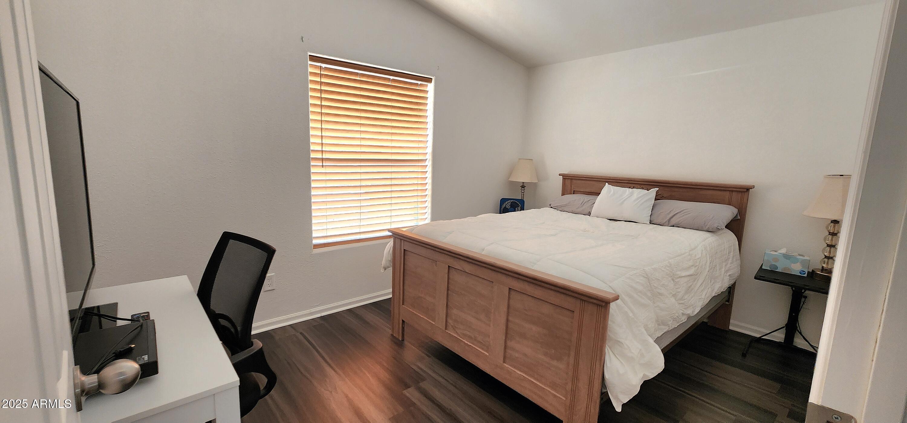 234 West Lone Ranger Trail Tonto Basin, AZ 85553 - Photo 25 of 27 a bedroom with a bed a chair and table