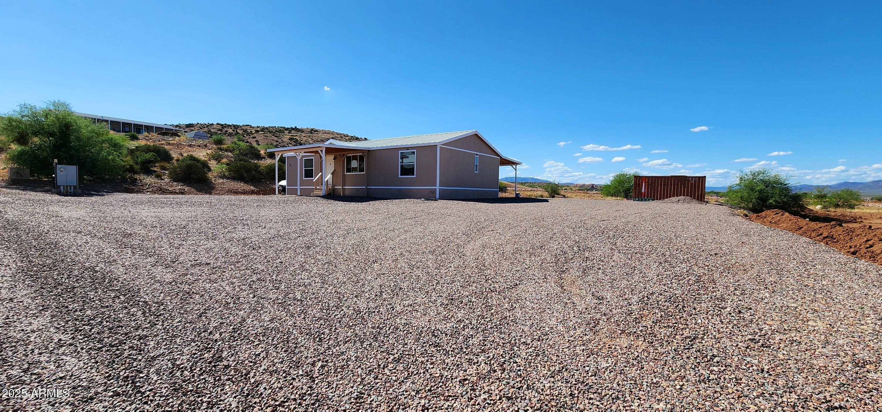 234 West Lone Ranger Trail Tonto Basin, AZ 85553 - Photo 4 of 27 a front view of a house with a yard
