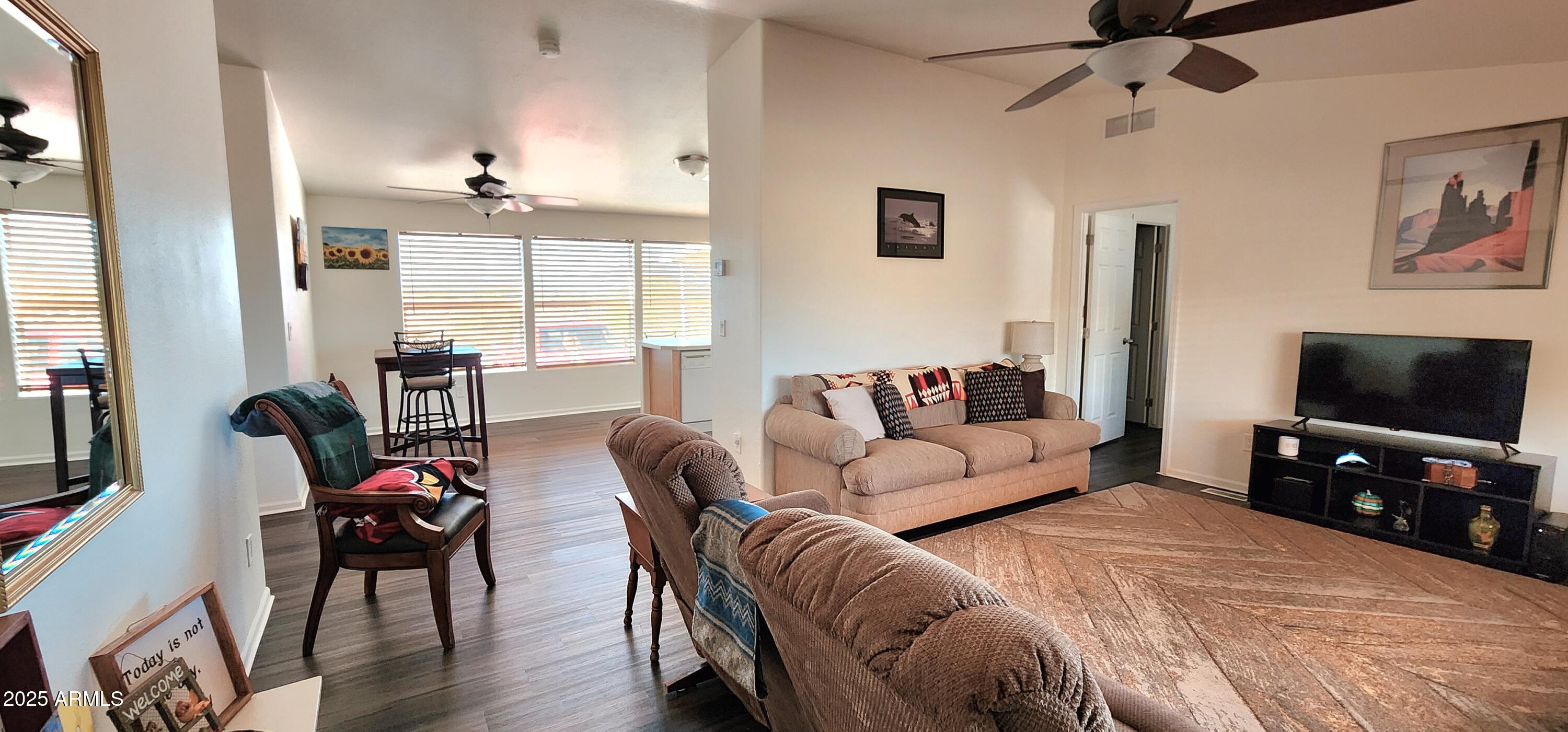 234 West Lone Ranger Trail Tonto Basin, AZ 85553 - Photo 7 of 27 a living room with furniture and a flat screen tv