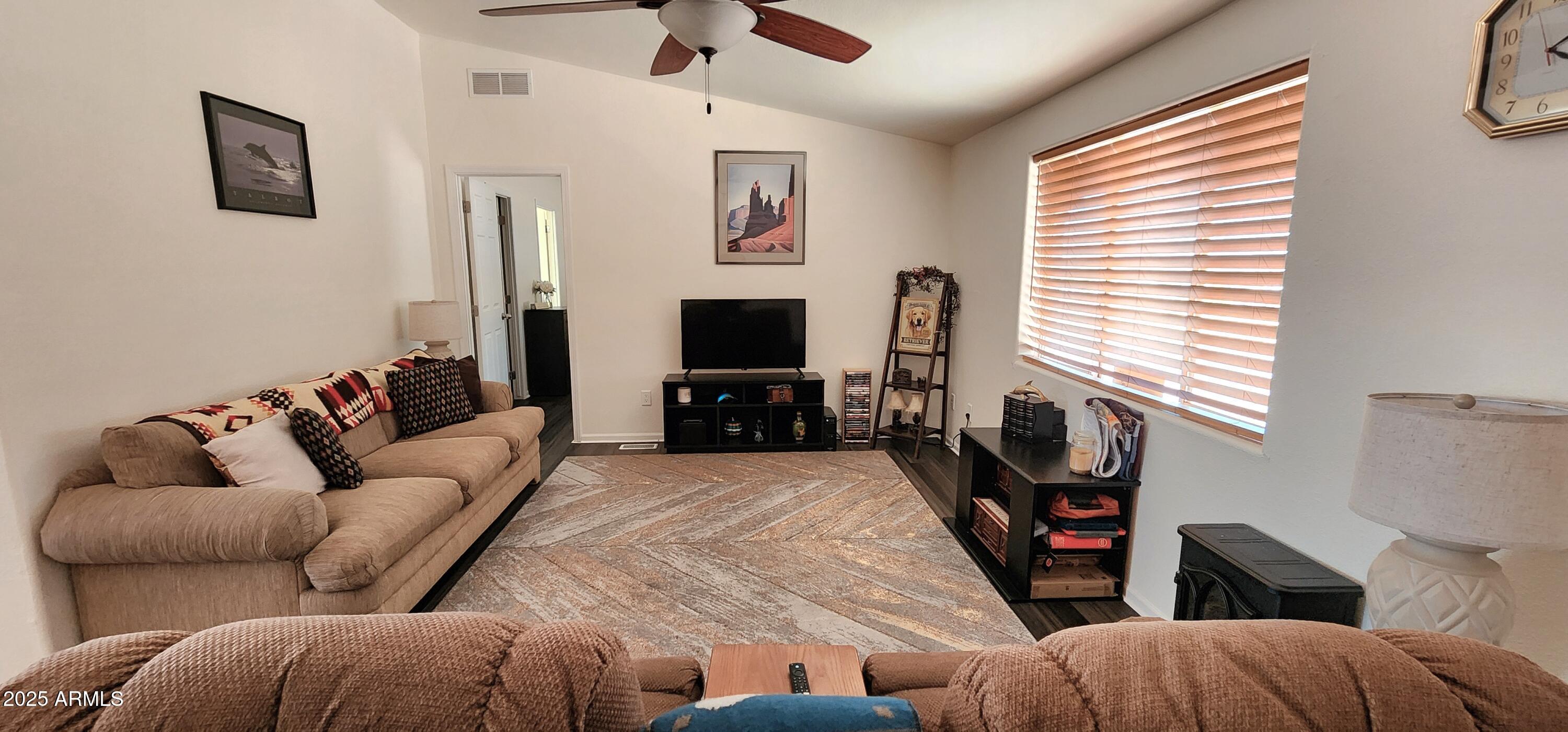 234 West Lone Ranger Trail Tonto Basin, AZ 85553 - Photo 8 of 27 a living room with furniture and a flat screen tv