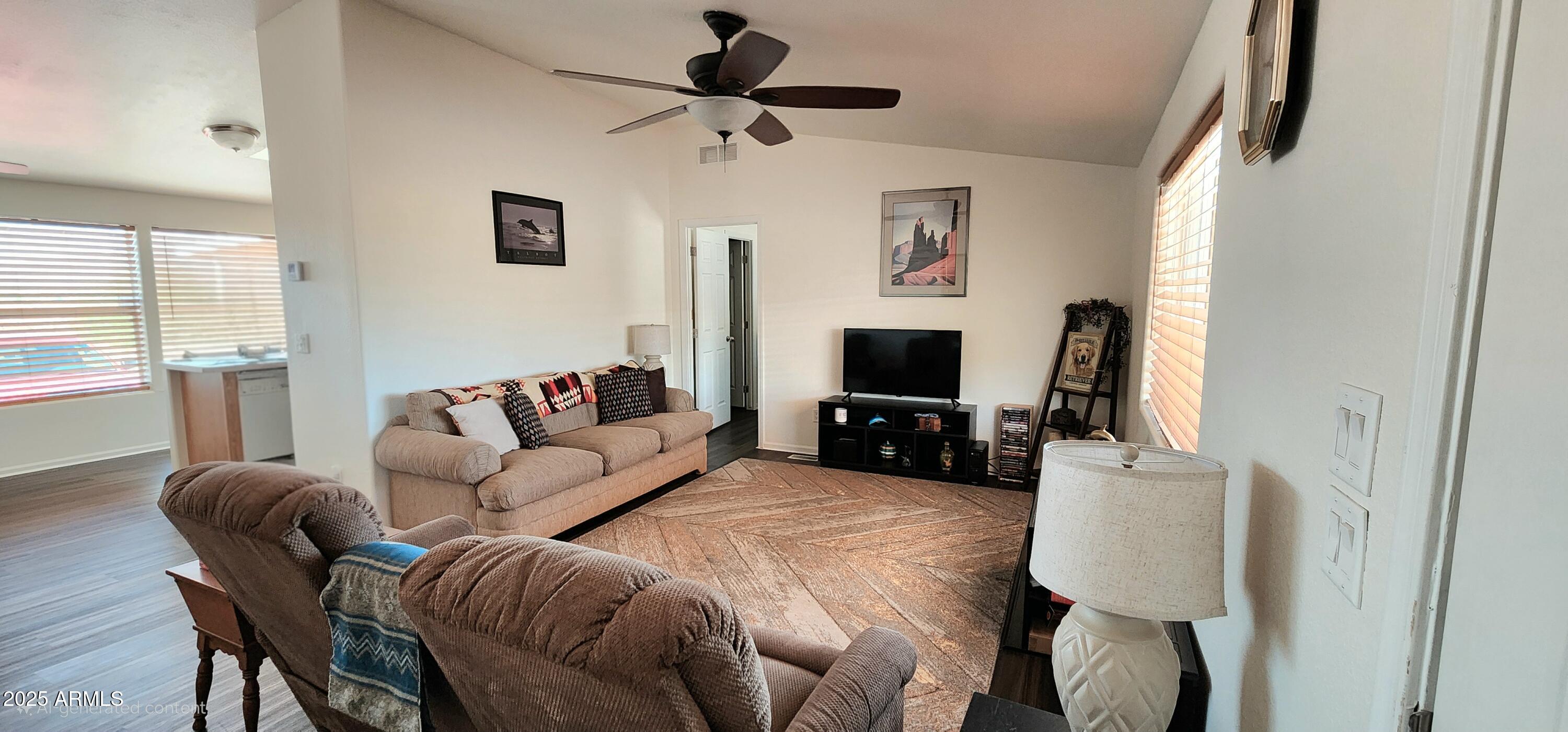 234 West Lone Ranger Trail Tonto Basin, AZ 85553 - Photo 10 of 27 a living room with furniture a flat screen tv and a window