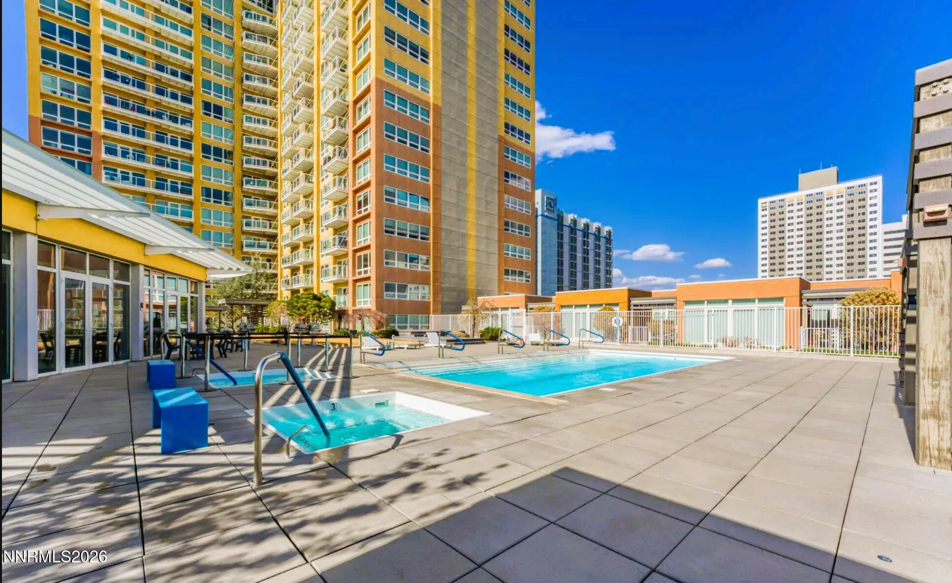 255 North Sierra Street, Unit 517 Reno, NV 89501 - Photo 15 of 43 front view of a building with a yard