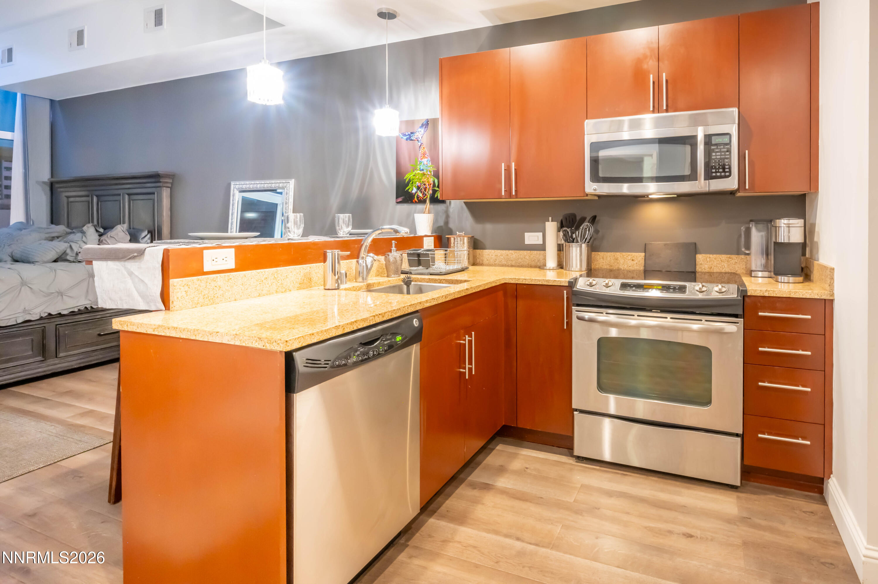 255 North Sierra Street, Unit 517 Reno, NV 89501 - Photo 31 of 43 a kitchen with stainless steel appliances granite countertop a stove a sink and a microwave