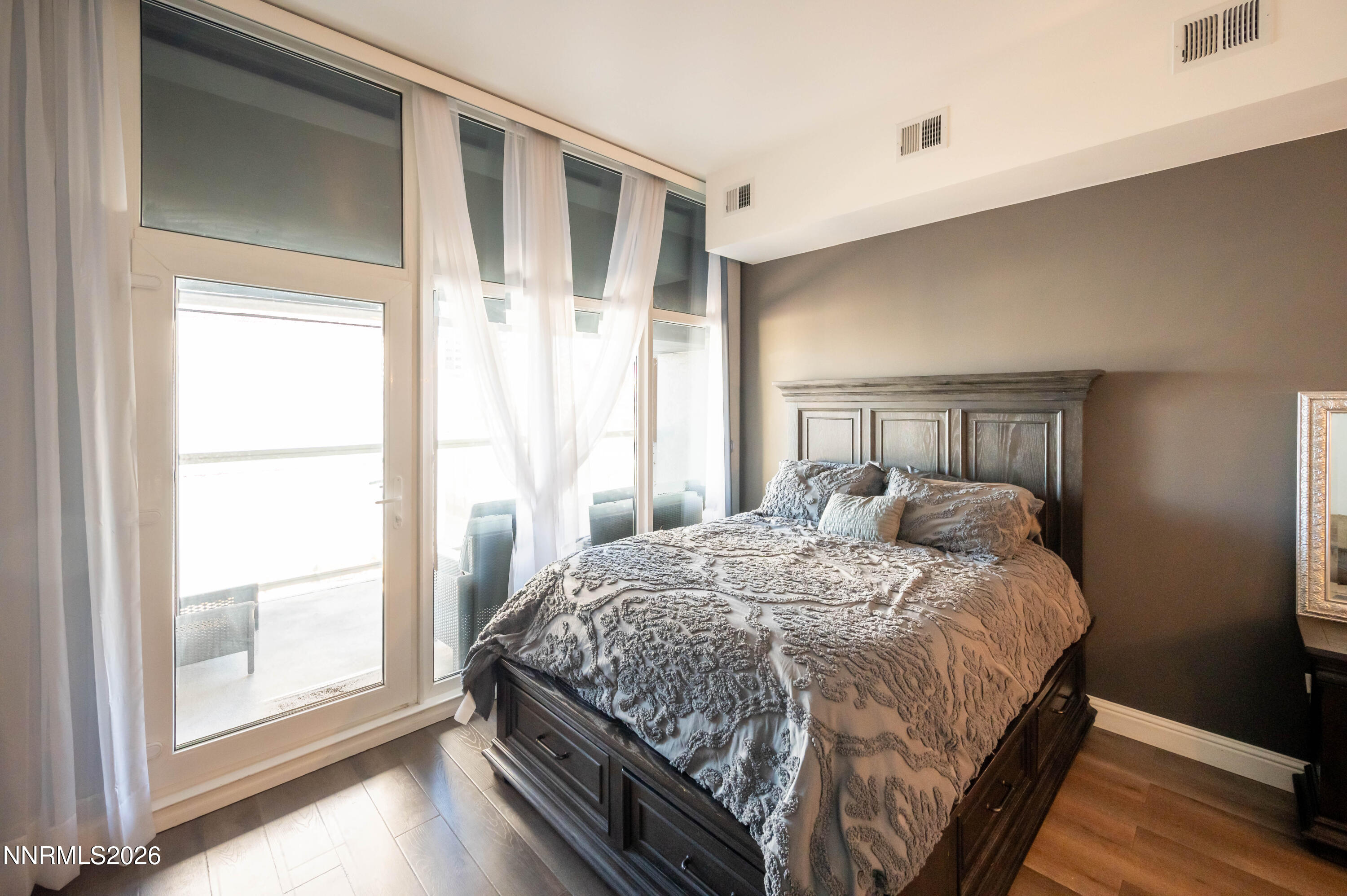 255 North Sierra Street, Unit 517 Reno, NV 89501 - Photo 4 of 43 a bedroom with a bed and a large window