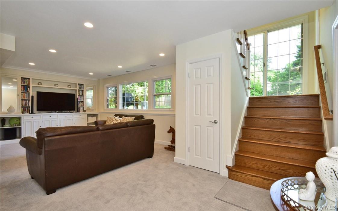 9 Franklin Avenue Rye, NY 10580 - Photo 25 of 35 a living room with furniture and a flat screen tv