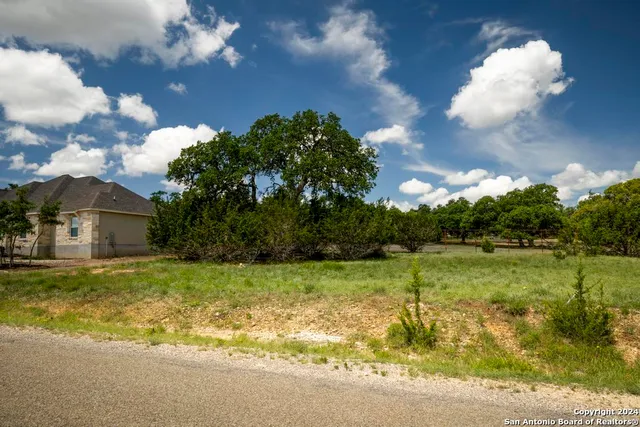 a view of a fountain in front of a house