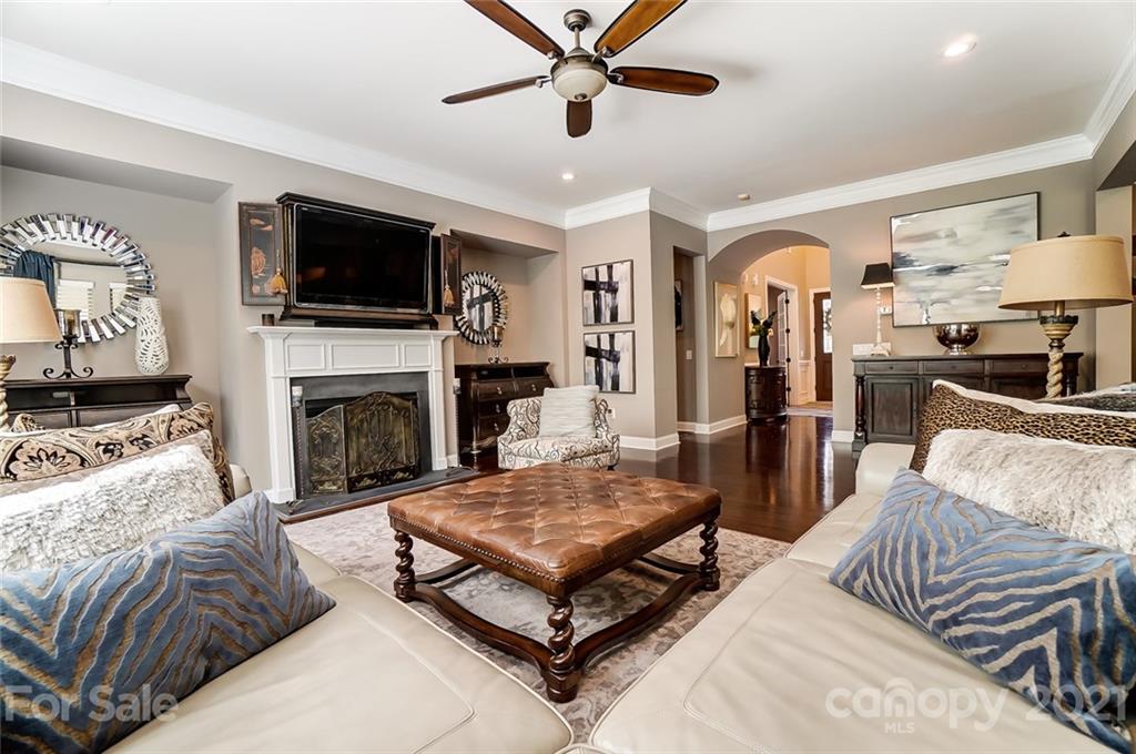 1362 Afton Way Fort Mill, SC 29708 - Photo 13 of 48 a living room with furniture a flat screen tv and a fireplace