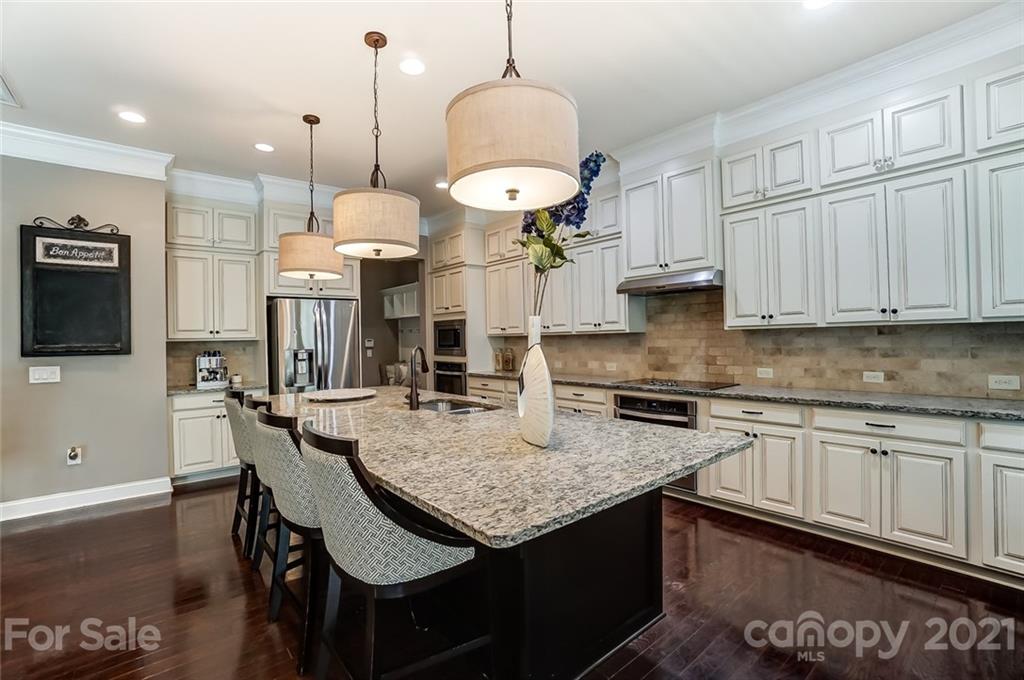 1362 Afton Way Fort Mill, SC 29708 - Photo 16 of 48 a kitchen with stainless steel appliances granite countertop a stove a sink and a microwave