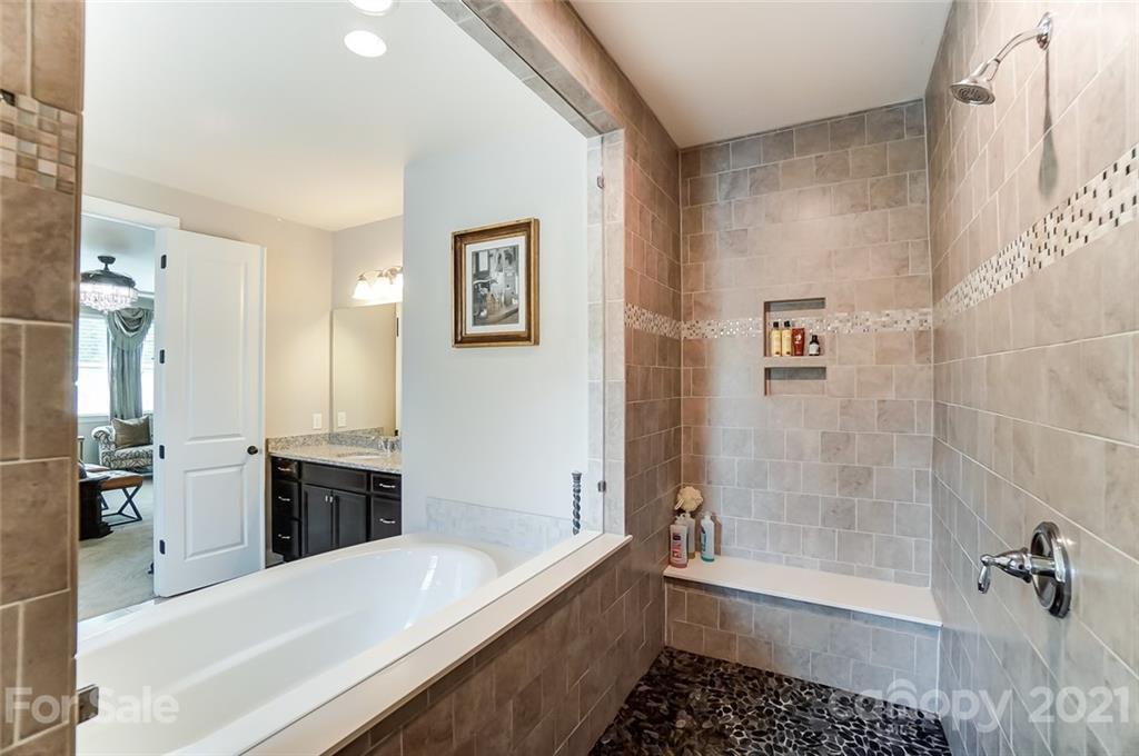 1362 Afton Way Fort Mill, SC 29708 - Photo 32 of 48 a bathroom with a bathtub and a shower