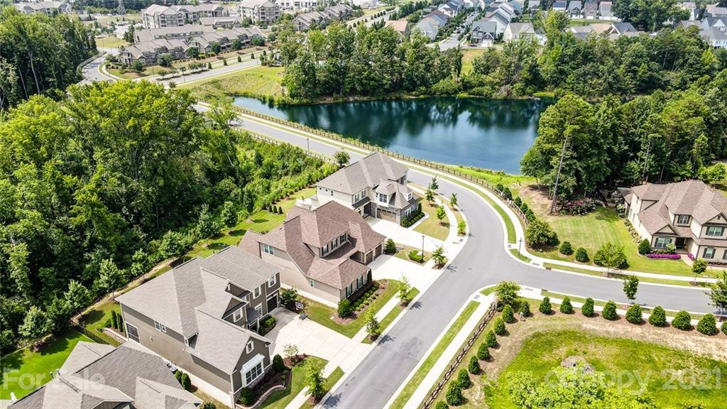 1362 Afton Way Fort Mill, SC 29708 - Photo 48 of 48 an aerial view of a house with swimming pool and lake view