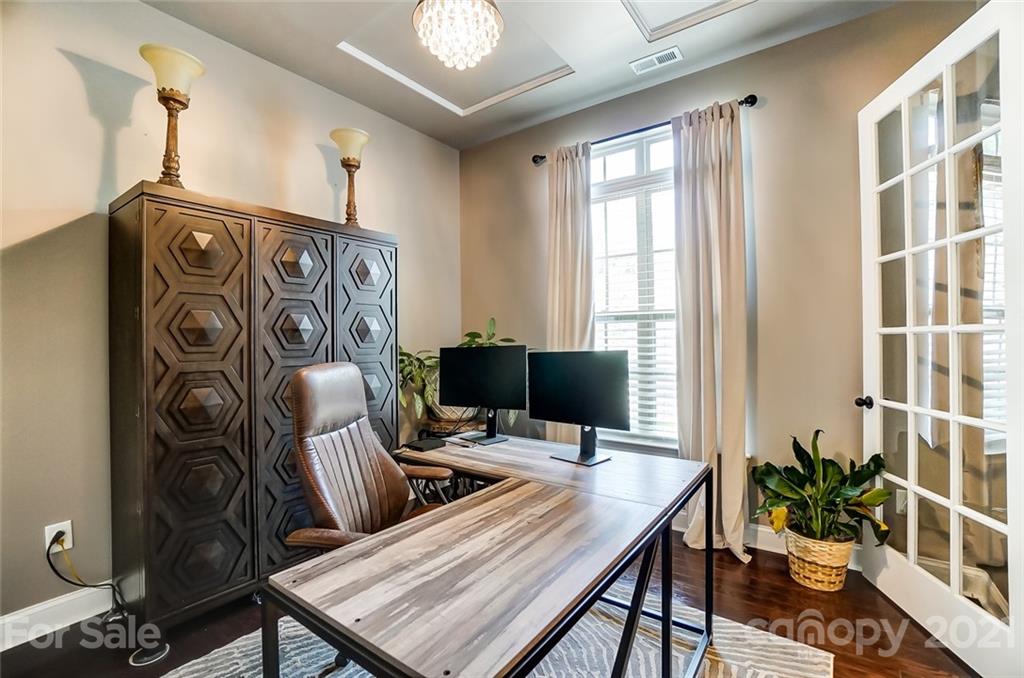 1362 Afton Way Fort Mill, SC 29708 - Photo 8 of 48 a view of a workspace with furniture and a potted plant