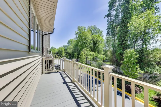 a view of a balcony with chairs