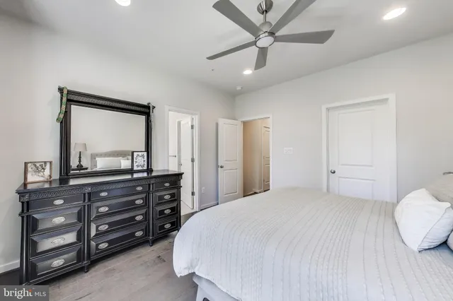 a bedroom with a bed and a dresser