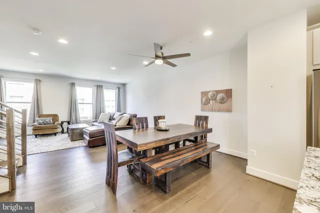 a living room with furniture a rug and a chandelier
