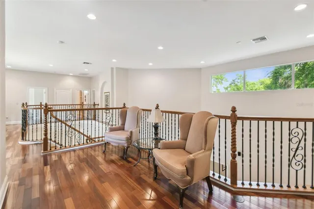 an empty room with closet and windows