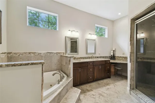 a living room with furniture a dining table and a window