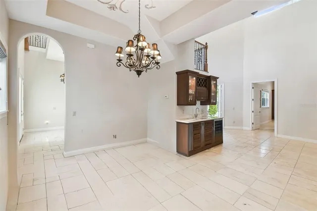 a view of a kitchen with a sink dishwasher a refrigerator and a stove