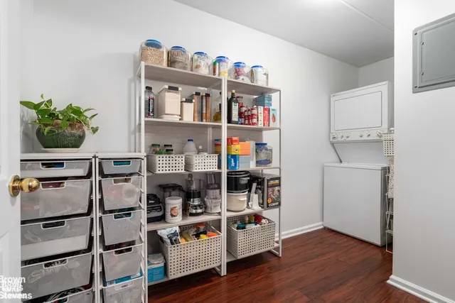a view of living room and workspace with furniture